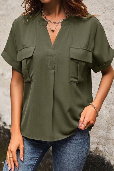 a woman wearing a green shirt and jeans