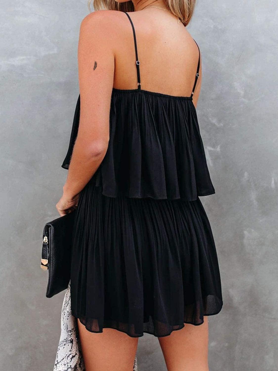 a woman wearing a black dress and a hat