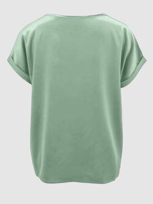 a women's green top with short sleeves