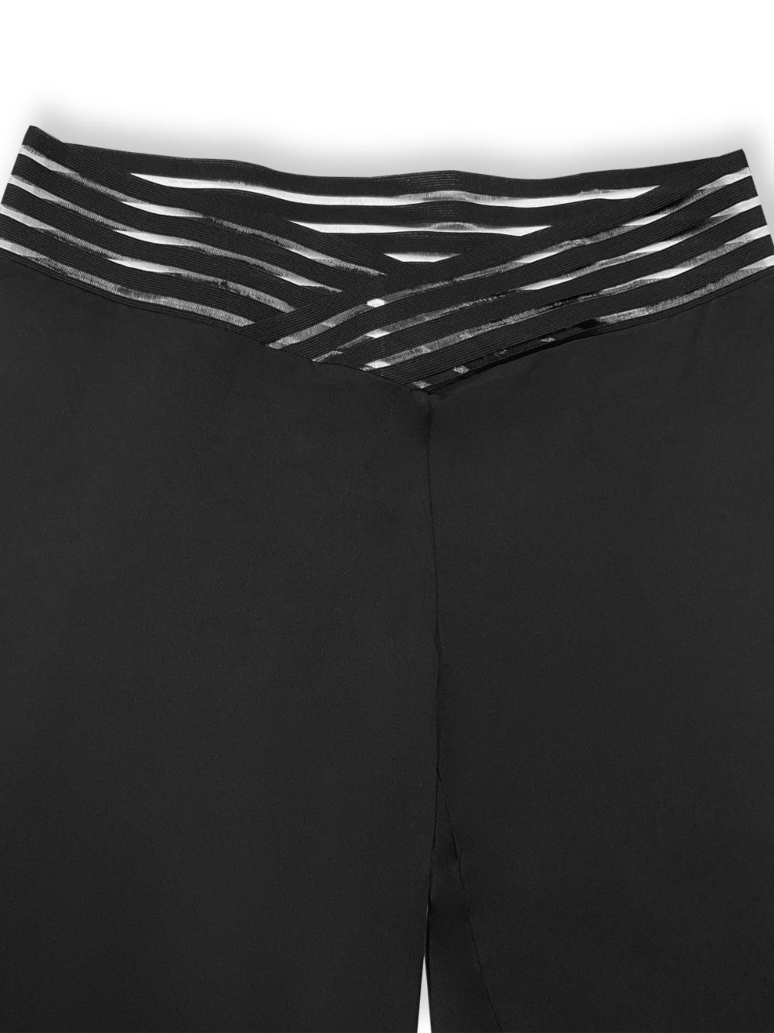 a close up of a woman's black pants