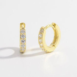 a pair of gold hoop earrings with diamonds