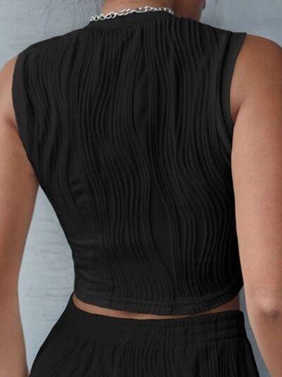 a woman wearing a black dress with a high neck