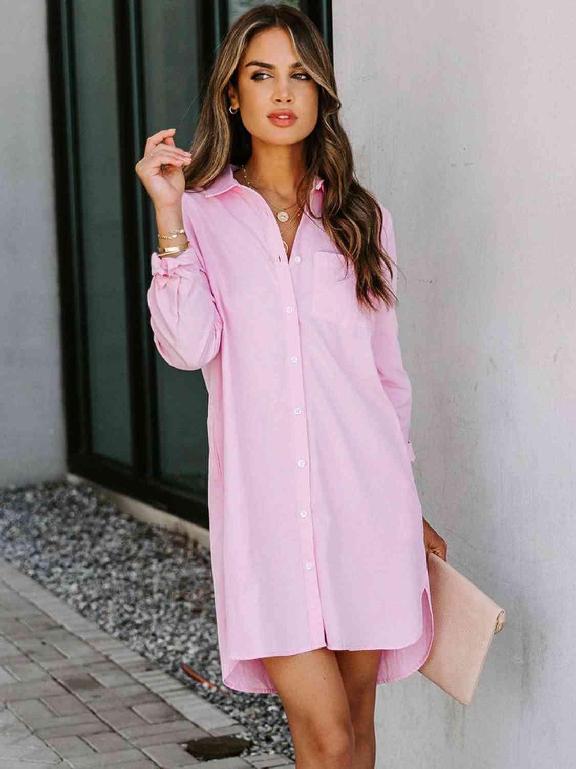 a woman wearing a pink shirt dress