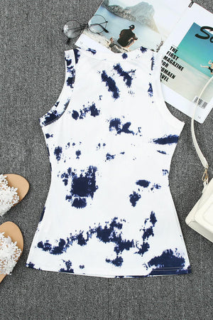 a pair of sandals, a magazine, and a white and blue dress on a