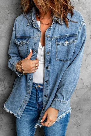 a woman wearing a jean jacket and jeans
