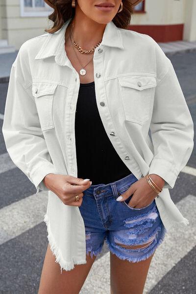 a woman wearing a white jacket and denim shorts