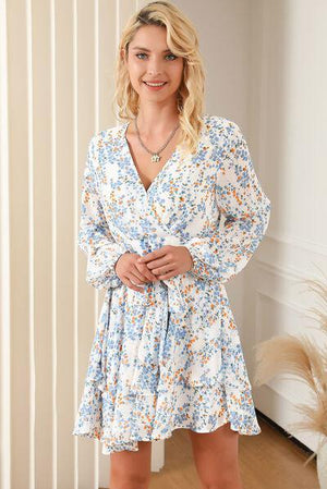 a woman standing in a room wearing a dress