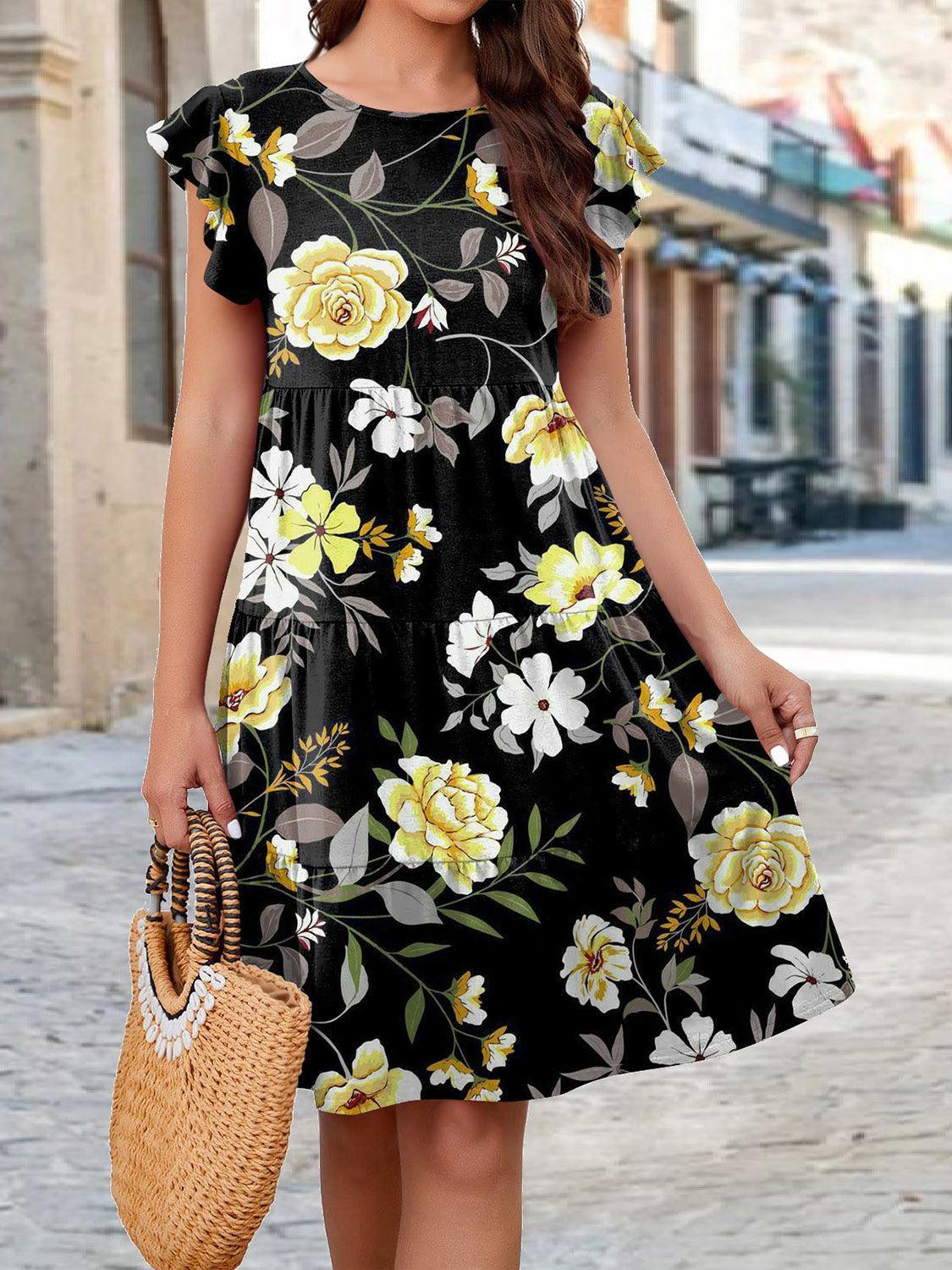 a woman in a black floral print dress