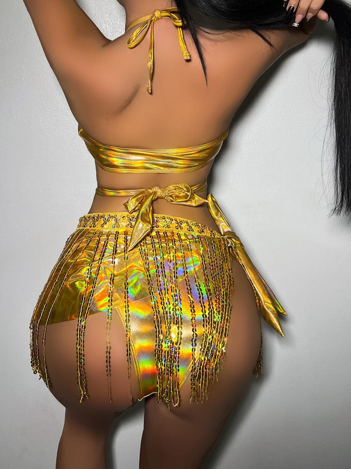 a woman in a yellow bikini top and skirt