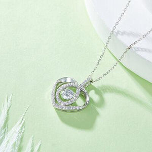 a diamond heart pendant on a chain