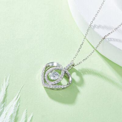 a diamond heart pendant on a chain