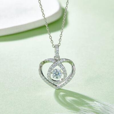 a heart shaped diamond pendant on a chain