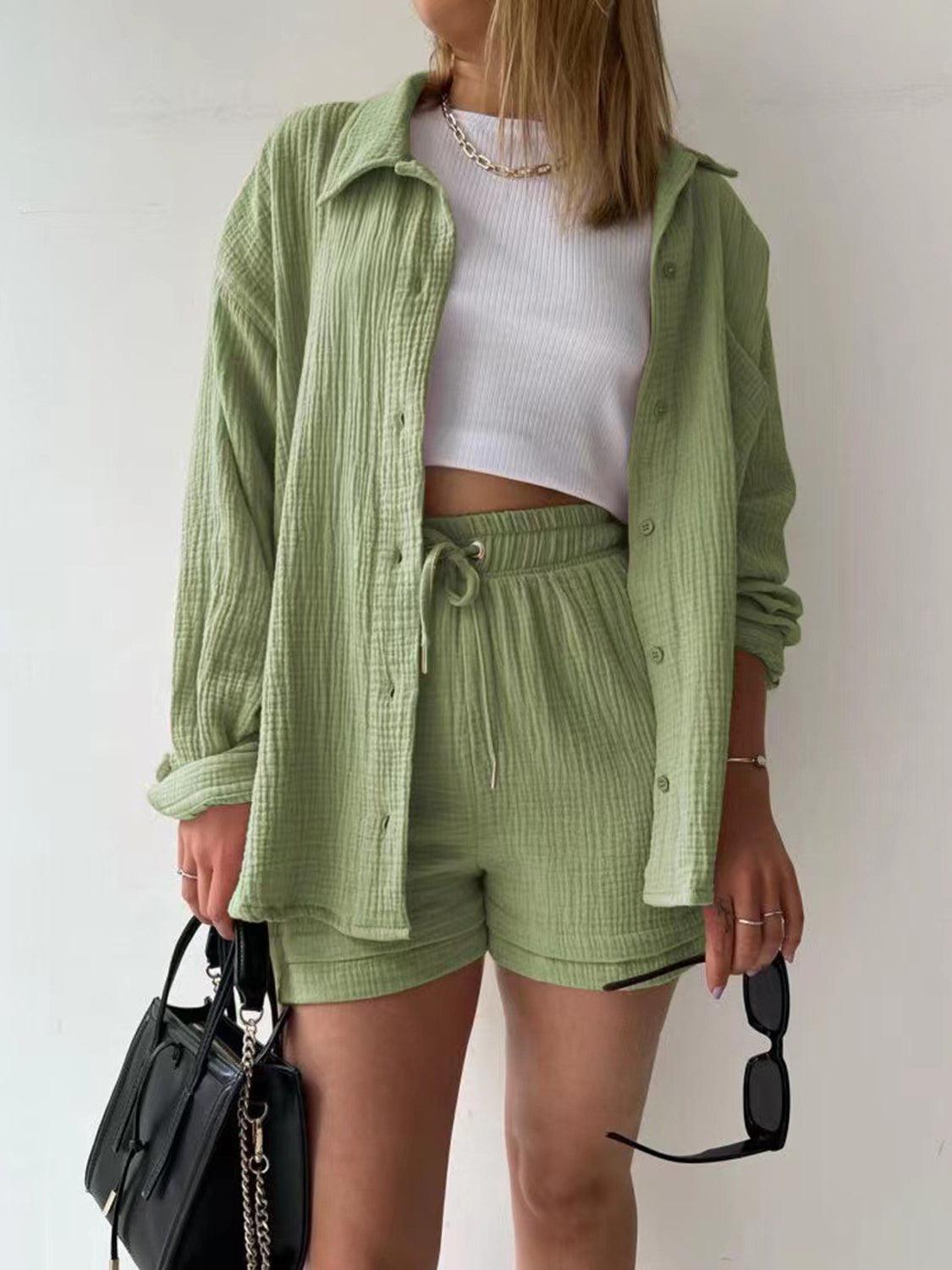 a woman wearing a green jacket and shorts