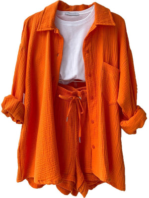 an orange jacket with a white shirt underneath it
