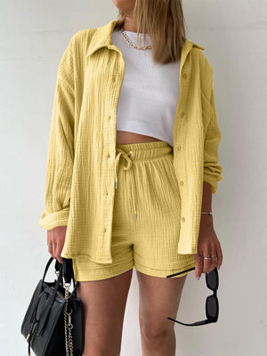 a woman wearing a yellow jacket and shorts