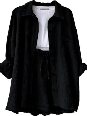 a black jacket with a white shirt underneath it