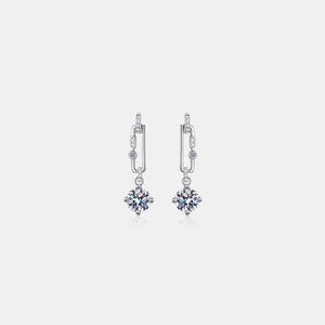 a pair of earrings on a white background