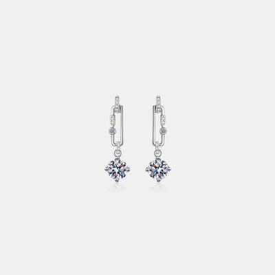 a pair of earrings on a white background