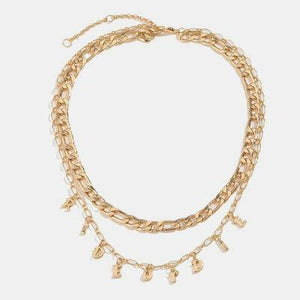 a gold chain necklace with charms and charms