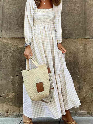 a woman in a white dress holding a white purse