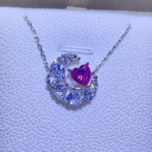 a necklace with a heart and a moon on it