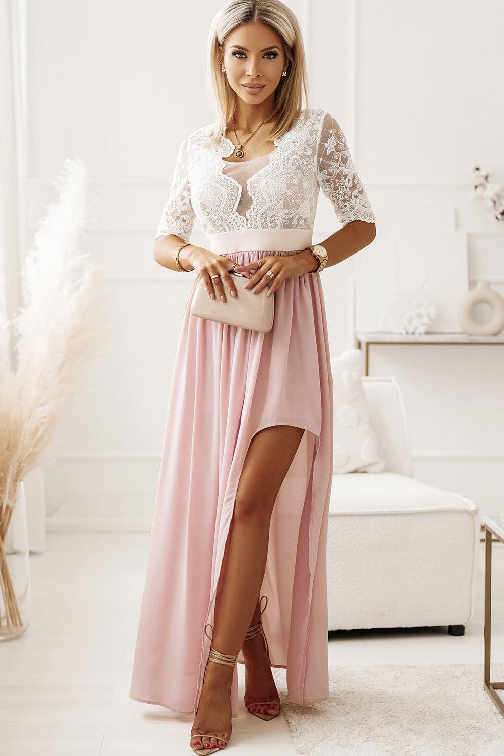 a woman in a long pink skirt and lace top