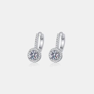 a pair of white gold earrings with diamonds