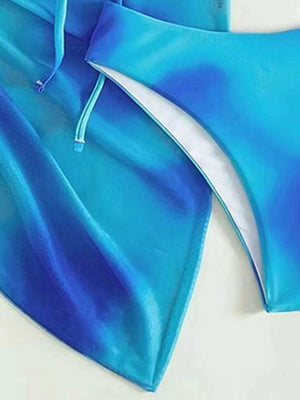 a pair of blue swimsuits laying on top of each other