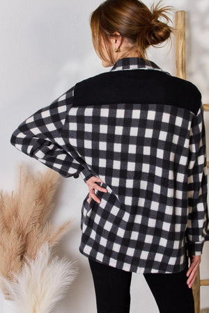 a woman in a black and white checkered shirt