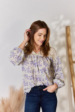 a woman wearing a blouse and jeans