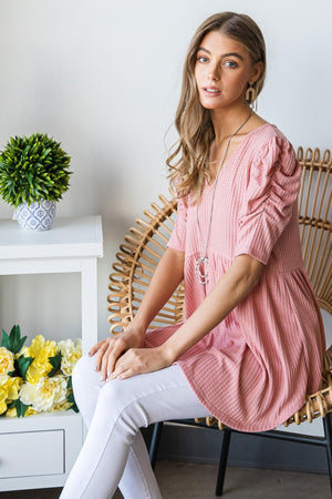 a woman sitting on a chair in a room
