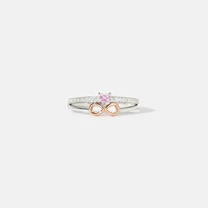 a ring with a pink diamond in the middle
