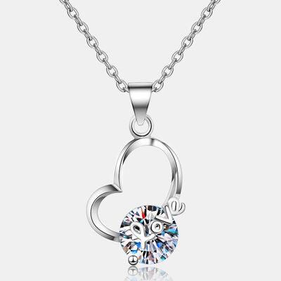 a necklace with a heart shaped pendant on a chain