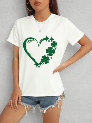 a woman wearing a t - shirt with a shamrock heart