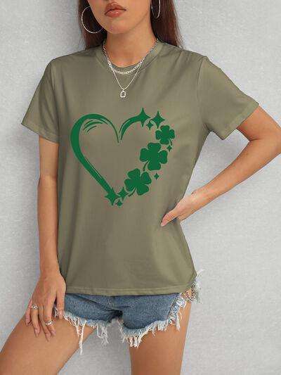 a woman wearing a t - shirt with a shamrock heart on it