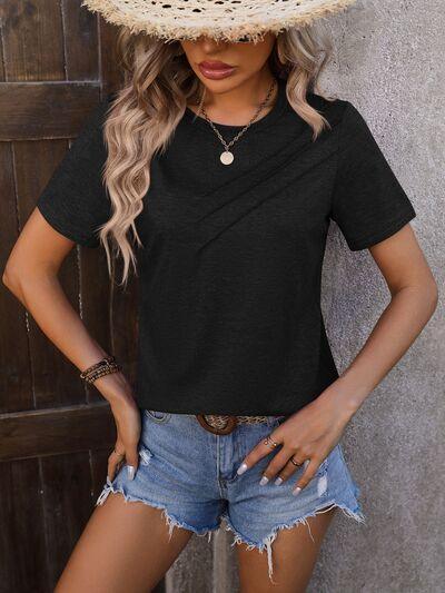 a woman wearing a straw hat and denim shorts