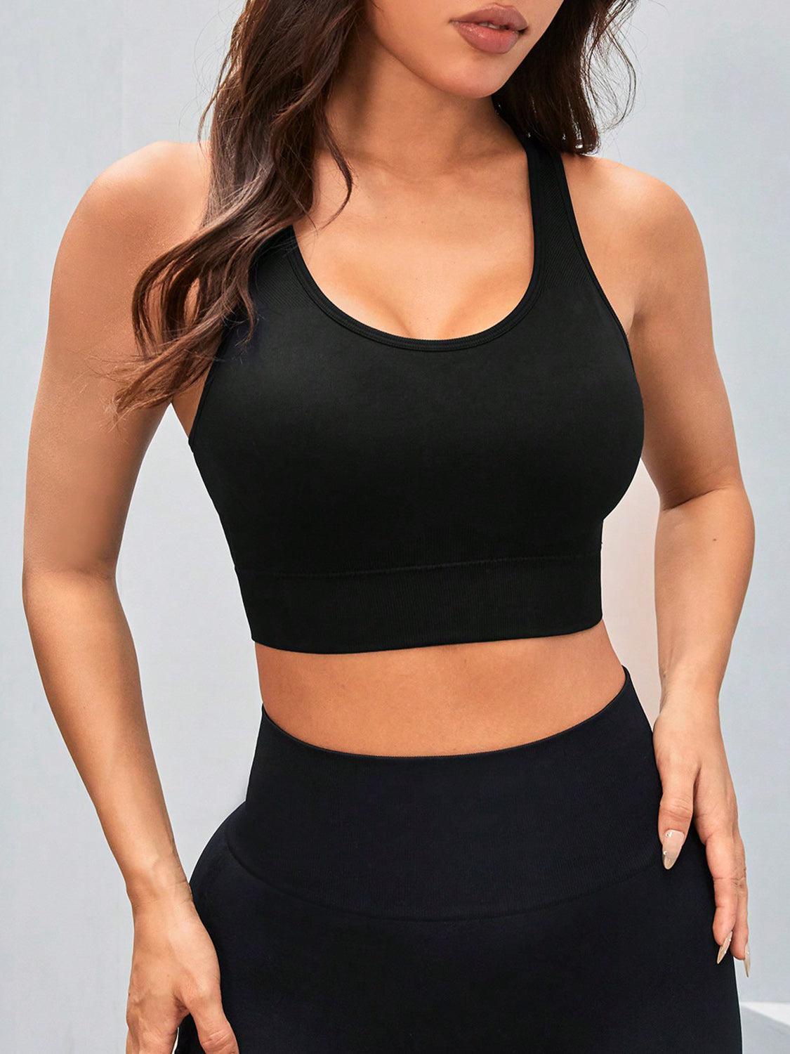 a woman wearing a black sports bra top