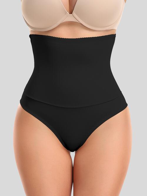 a woman in a black underwiret with a bra