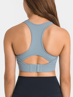 the back of a woman wearing a blue sports bra