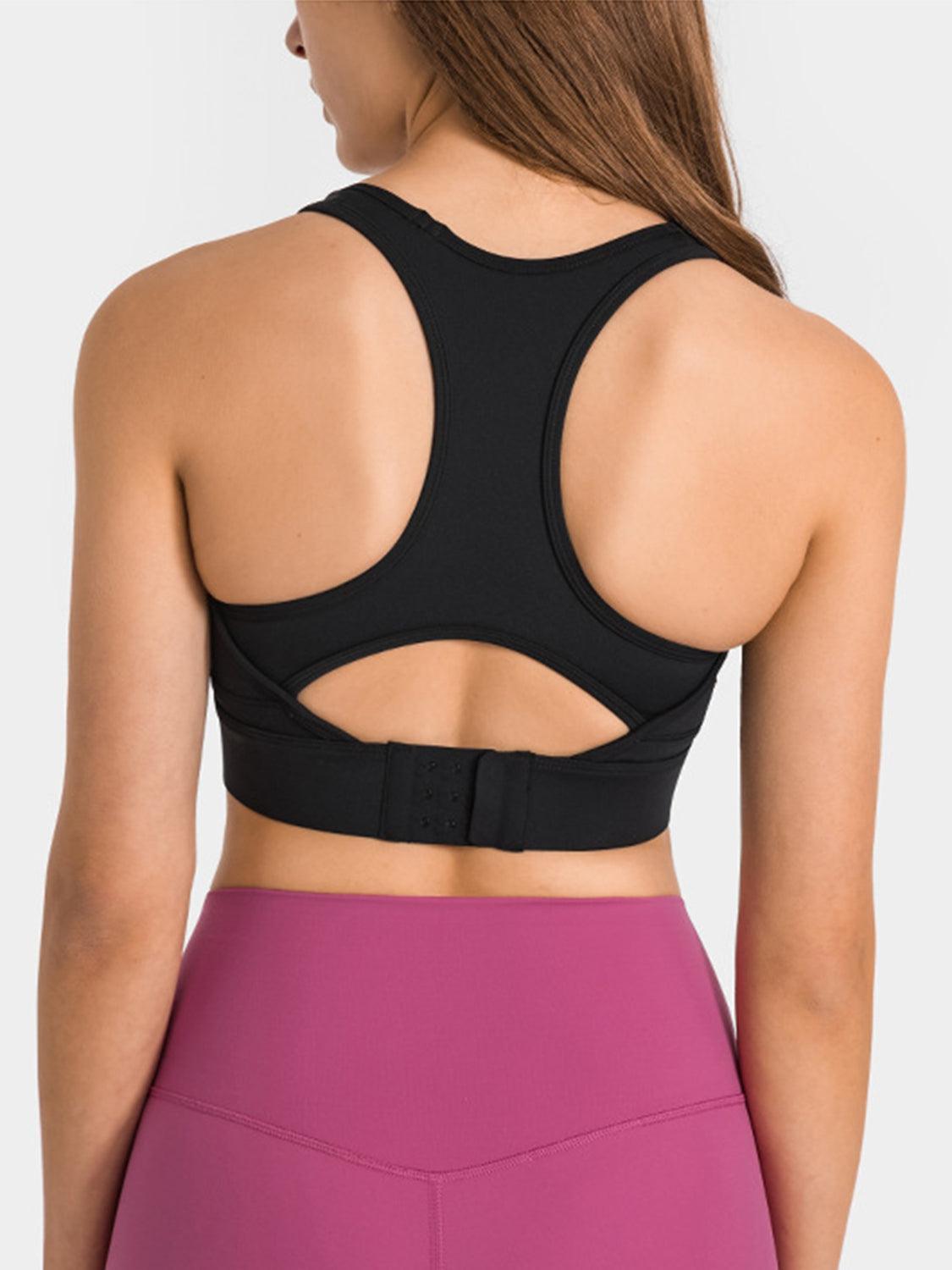 the back of a woman wearing a black sports bra top