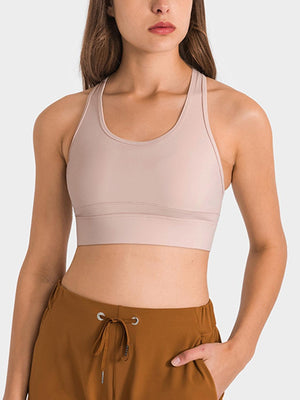 a woman wearing a tan sports bra top