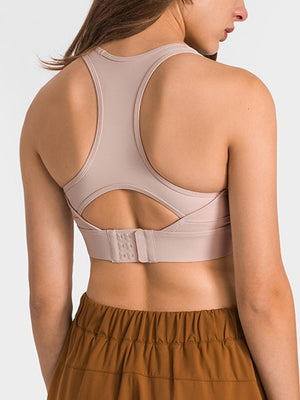 a woman in a sports bra top with a back view of the bra