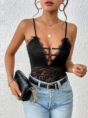 a woman wearing a black top and jeans