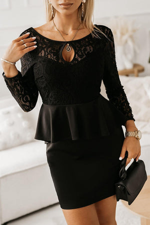 a woman wearing a black dress with a lace top