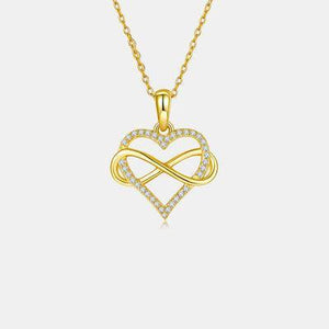 a gold necklace with a heart shaped pendant