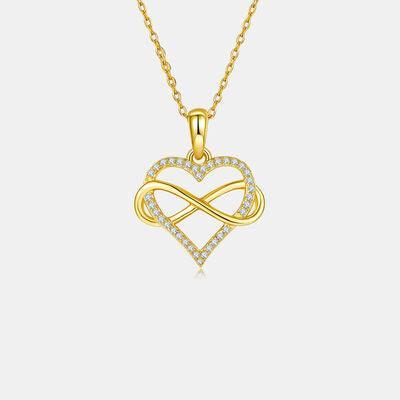 a gold necklace with a heart shaped pendant