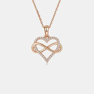 a heart shaped pendant with diamonds on a chain