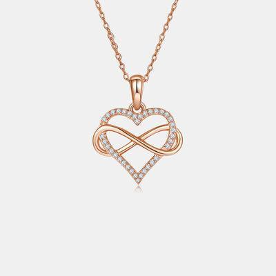 a heart shaped pendant with diamonds on a chain