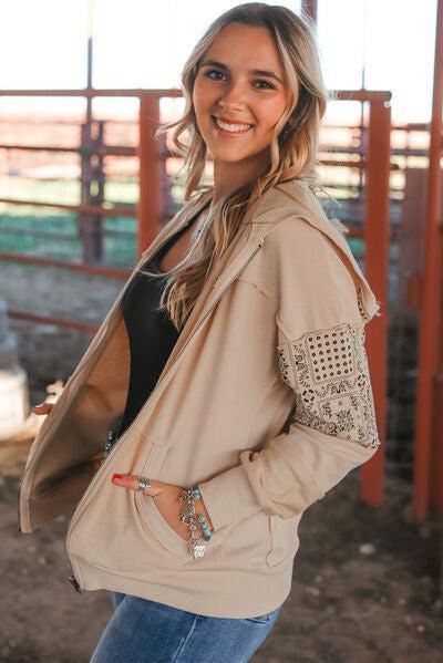 a beautiful woman standing in front of a fence