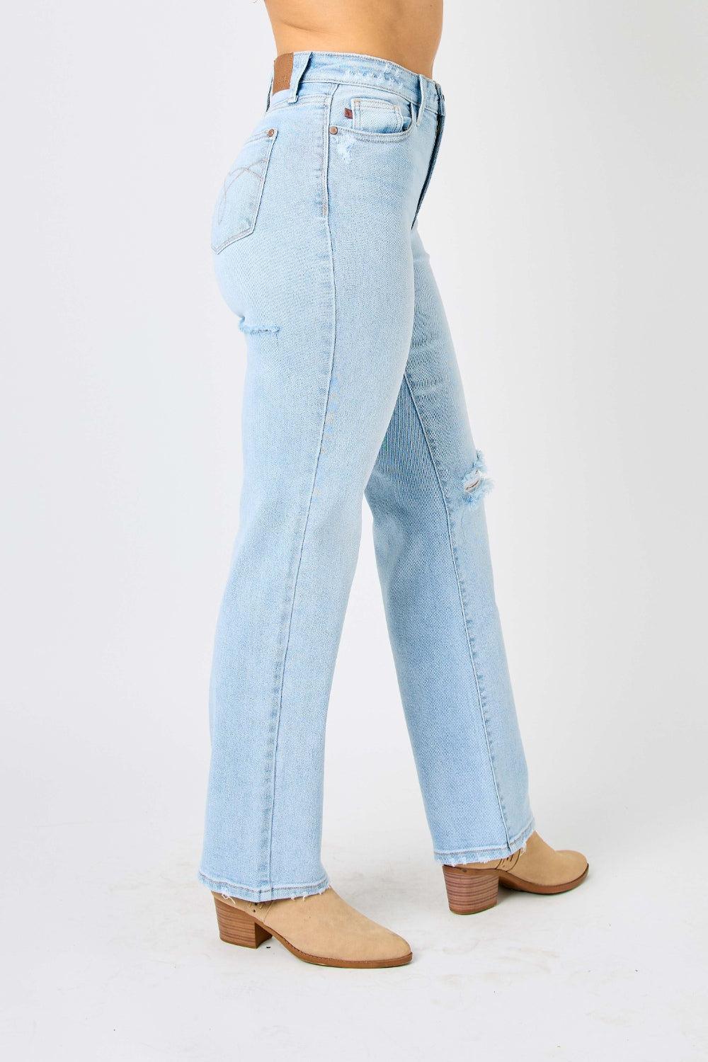 a woman in high heels and a pair of jeans